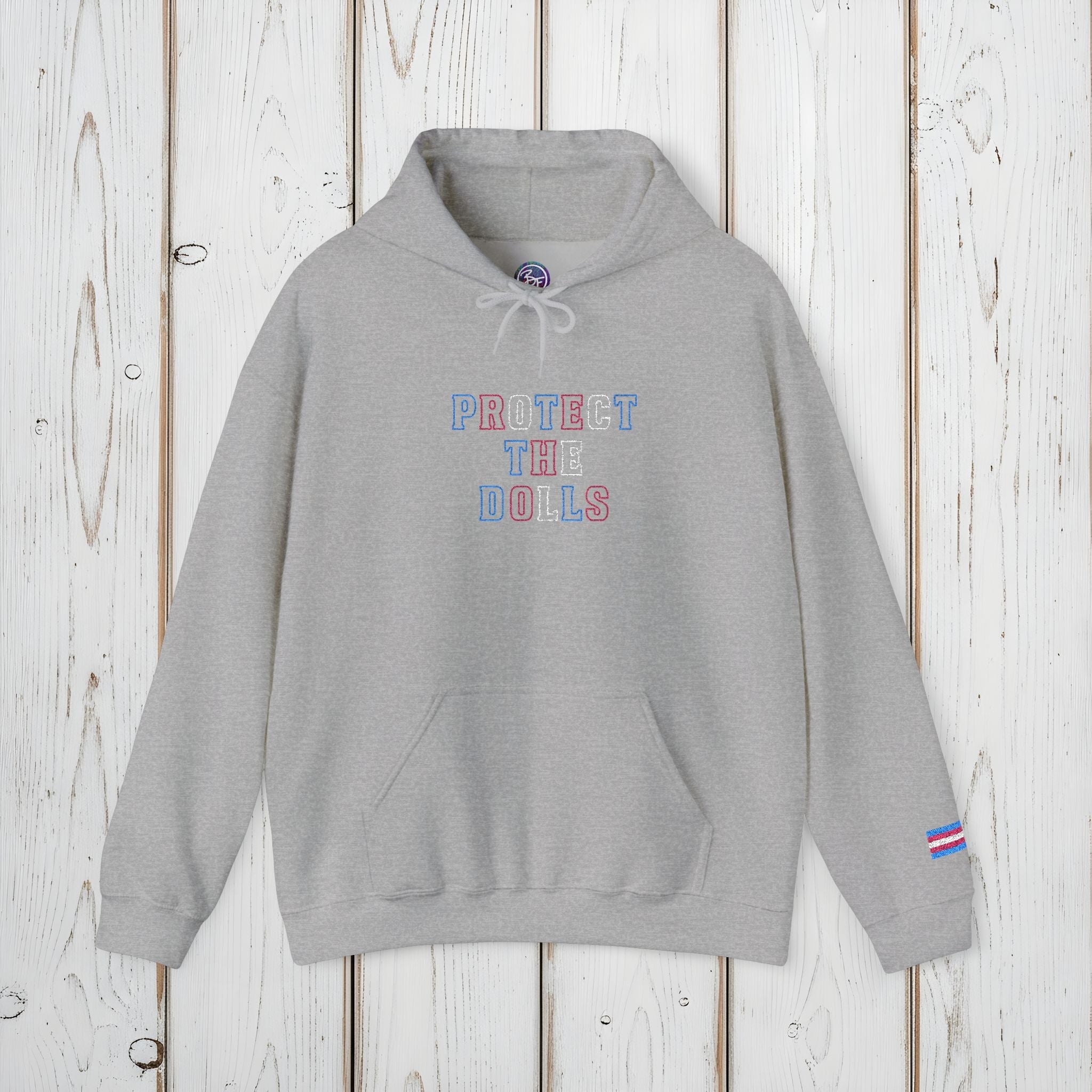 Bespattered Facade Protect the Dolls LGBTQ+ Pride Trans Support Embroidered Unisex Heavy Blend™ Hooded Sweatshirt