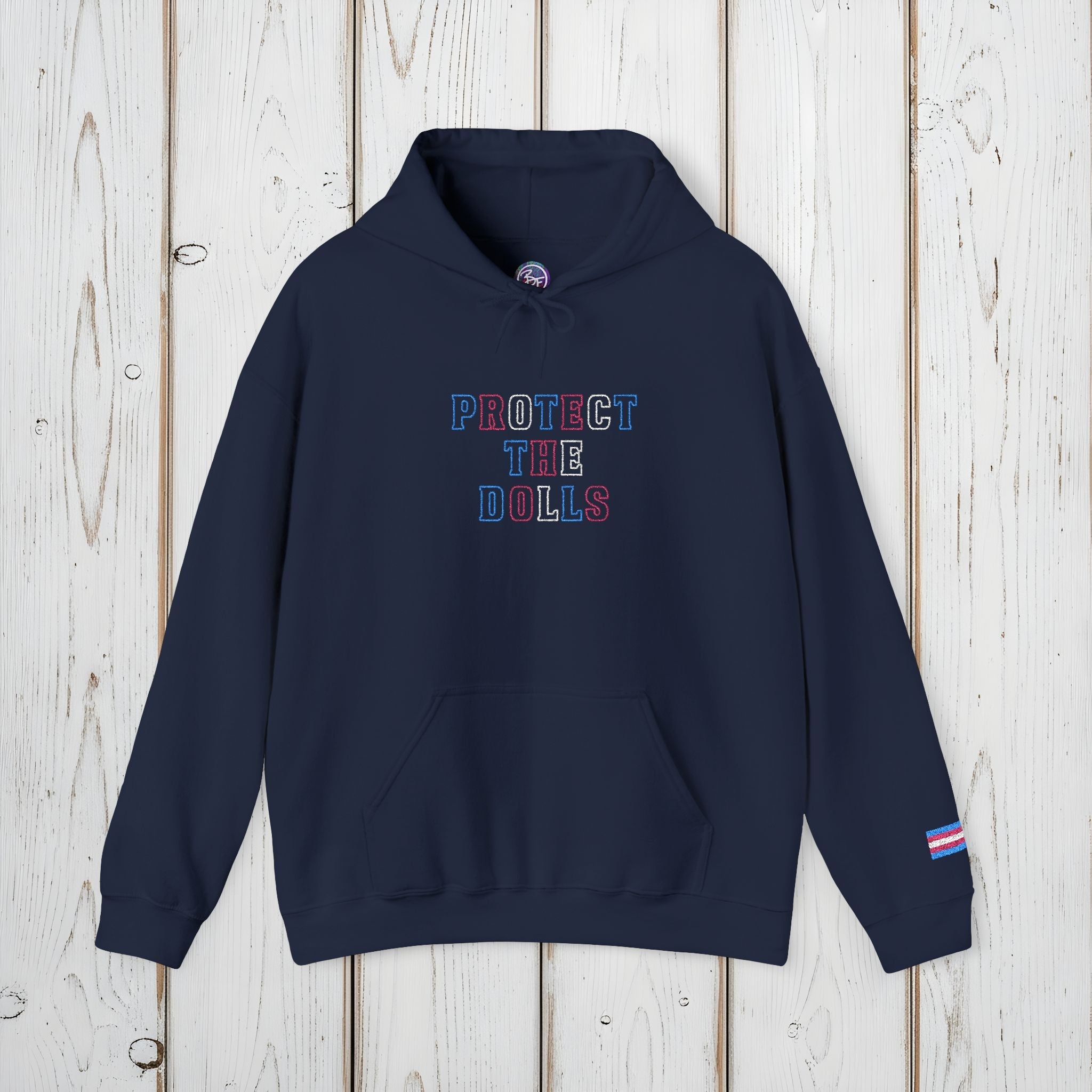 Bespattered Facade Protect the Dolls LGBTQ+ Pride Trans Support Embroidered Unisex Heavy Blend™ Hooded Sweatshirt